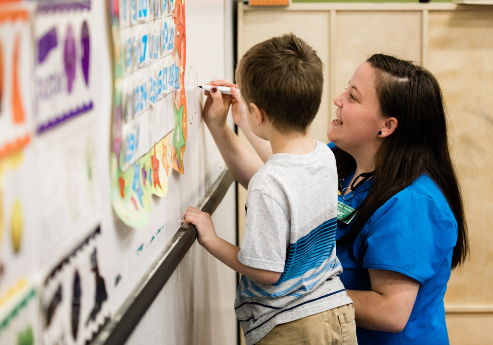 Counselor working with student one-on-one
